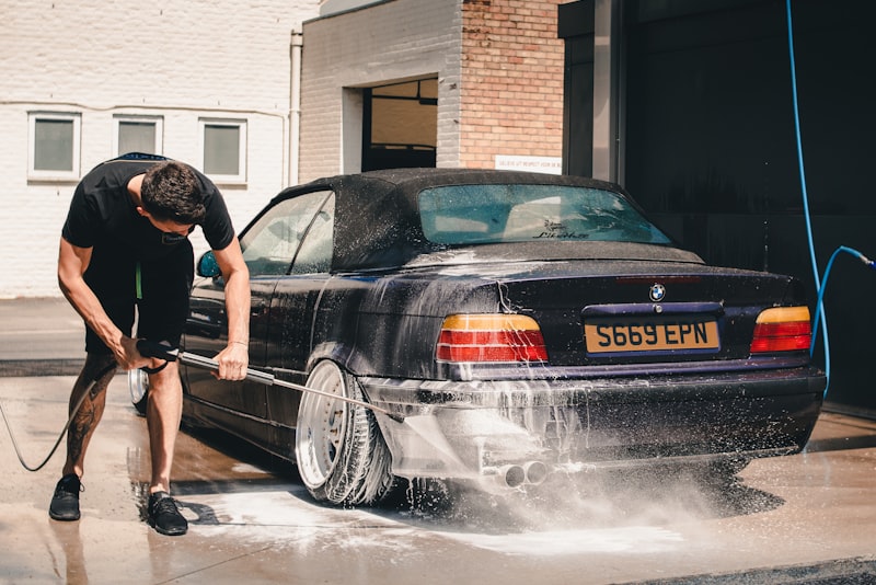A clean car with water beading on its freshly washed paintwork.